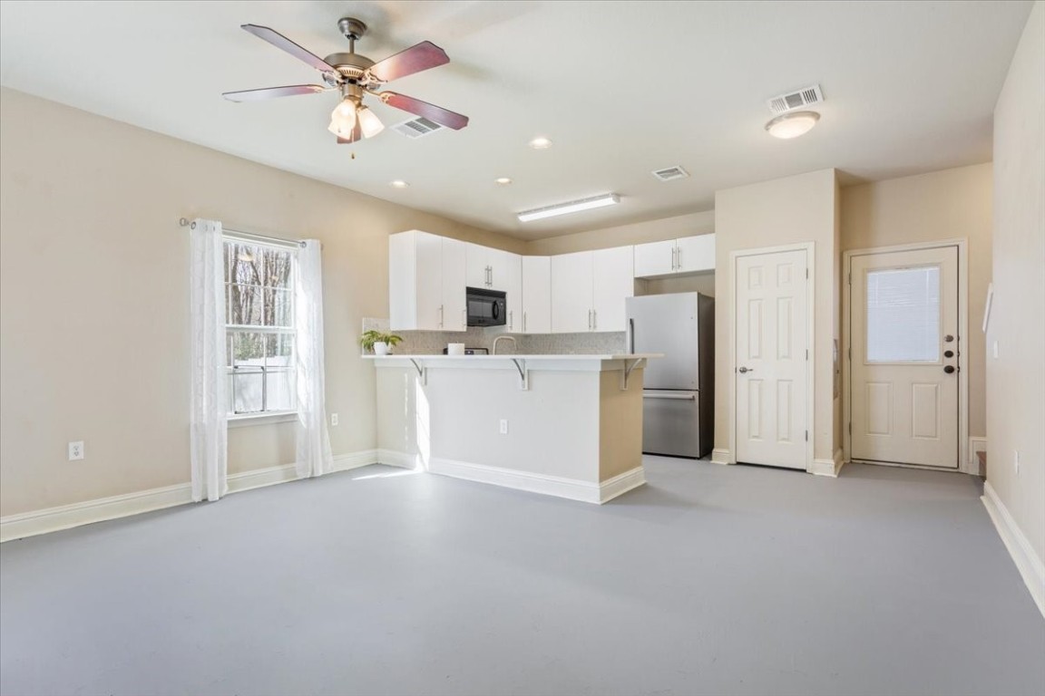 1210 East M. Franklin Avenue, Unit B Austin, TX 78721 - Photo 8 of 31 The space features neutral tones and updated finishes that complement any décor style.