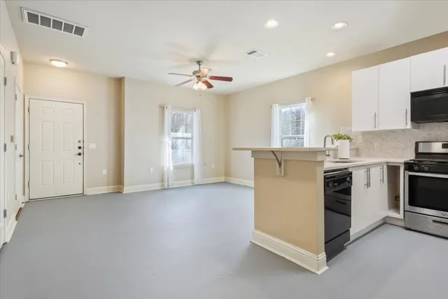 a view of a kitchen with a sink