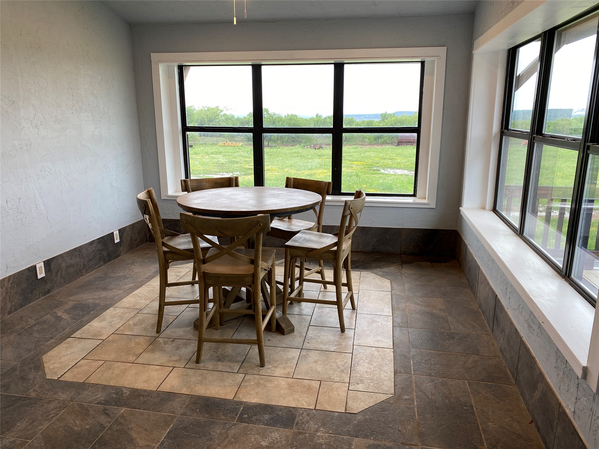 906 C R 235 Old Glory, TX 79540 - Photo 28 of 40 Dining space featuring stone tile flooring and plenty of natural light