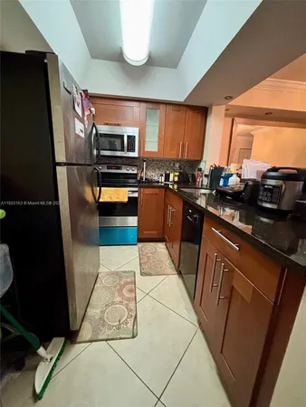 a kitchen with a stove and a microwave