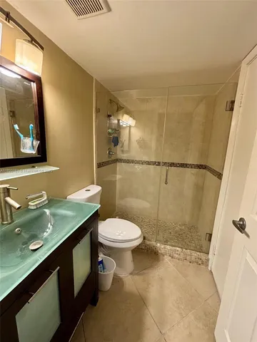 a bedroom with bed and window