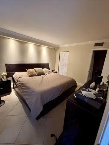 a bathroom with a sink mirror and toilet