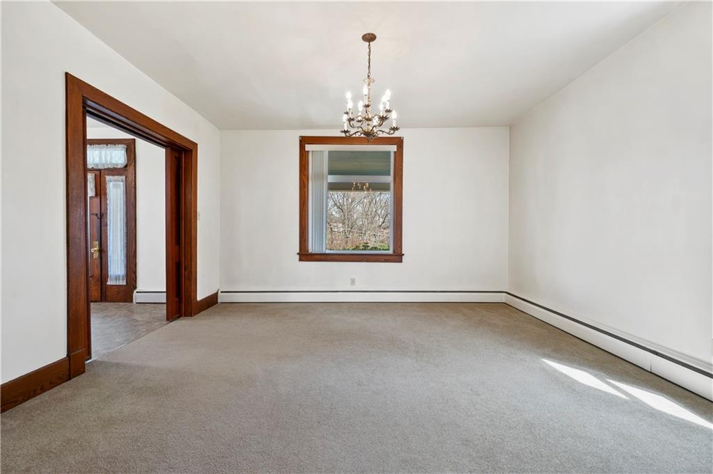 147 Ralston Road Sarver, PA 16055 - Photo 11 of 39 an empty room with chandelier and windows