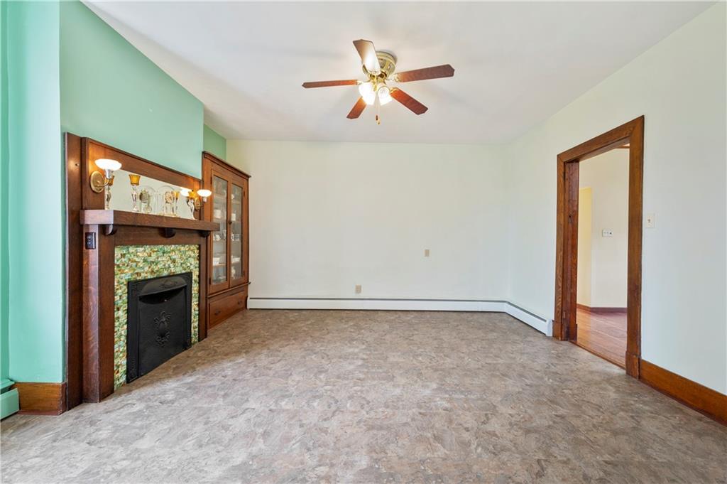 147 Ralston Road Sarver, PA 16055 - Photo 13 of 39 an empty room with fireplace fan and windows