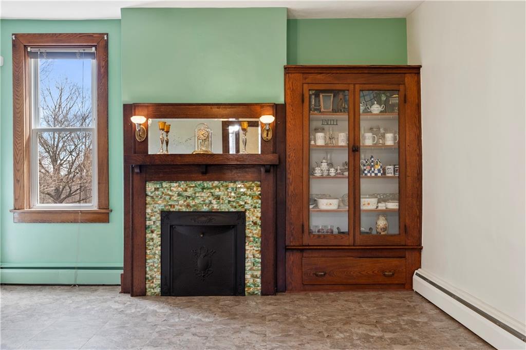 147 Ralston Road Sarver, PA 16055 - Photo 15 of 39 a living room with a fireplace and a window
