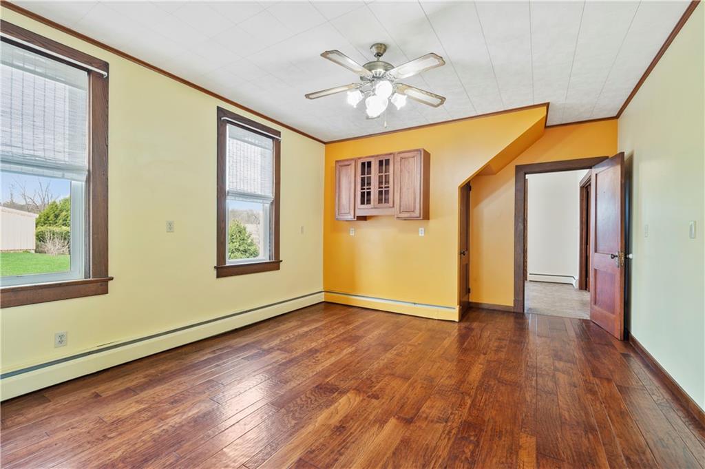 147 Ralston Road Sarver, PA 16055 - Photo 16 of 39 a view of an empty room with wooden floor and a window
