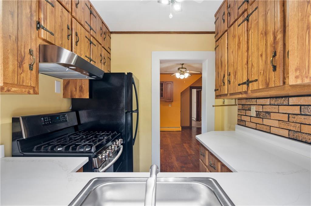 147 Ralston Road Sarver, PA 16055 - Photo 20 of 39 a kitchen with a sink and a stove top oven