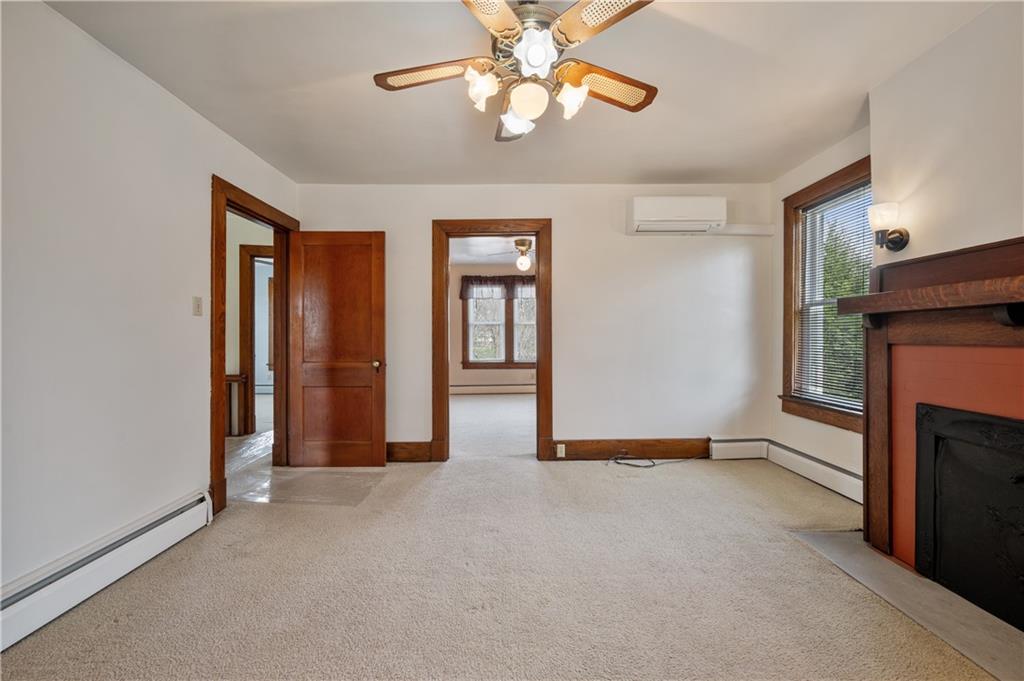 147 Ralston Road Sarver, PA 16055 - Photo 24 of 39 an empty room with windows and fireplace