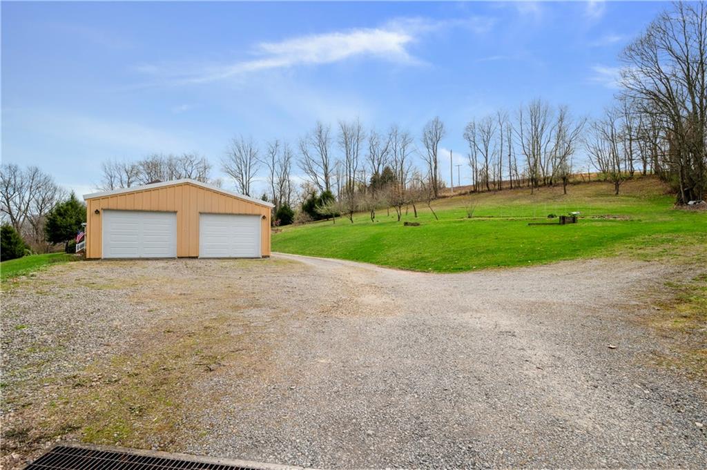 147 Ralston Road Sarver, PA 16055 - Photo 37 of 39 a front view of house with yard and trees all around