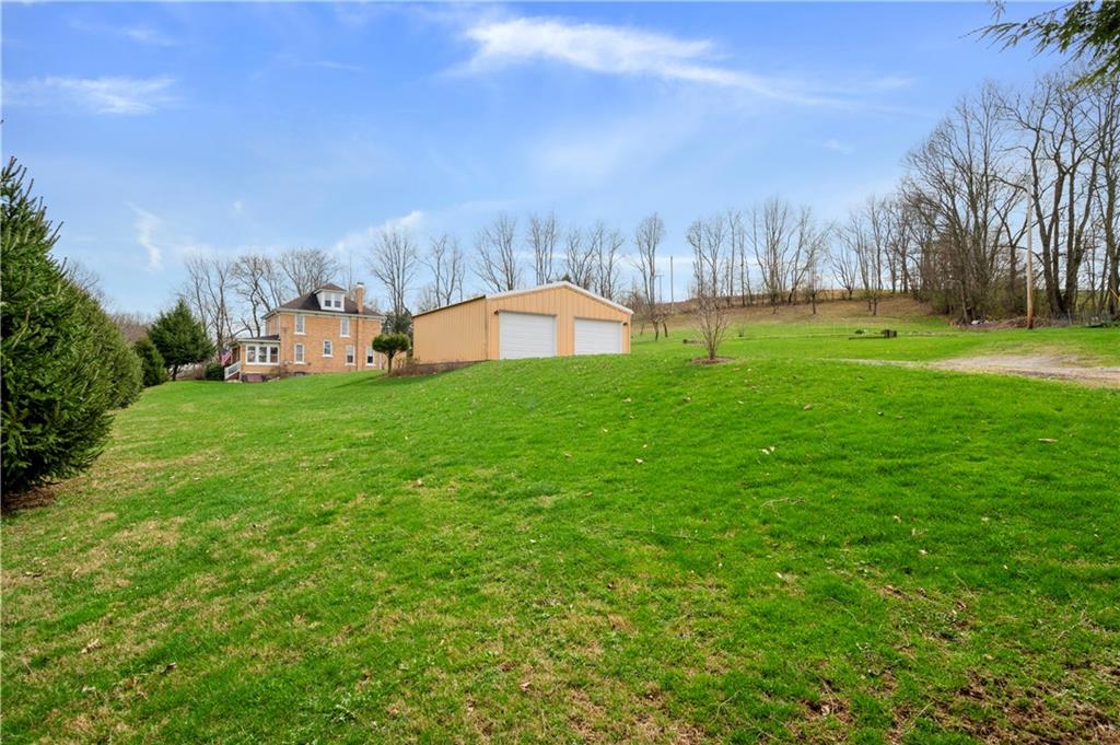 147 Ralston Road Sarver, PA 16055 - Photo 4 of 39 a backyard of a house with table and chairs