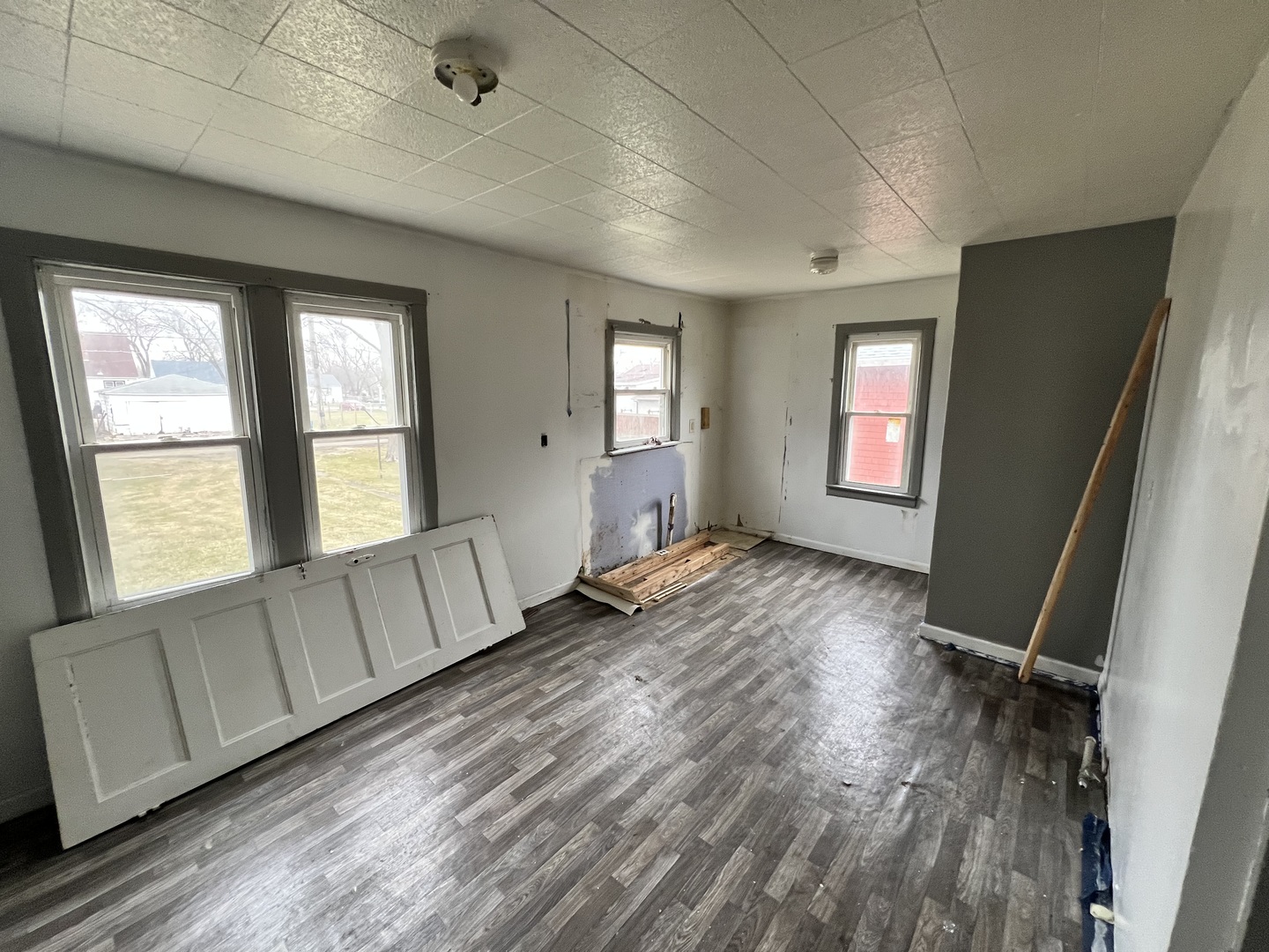 370 Albert Boulevard Kankakee, IL 60901 - Photo 5 of 20 a view of an empty room with wooden floor and a window