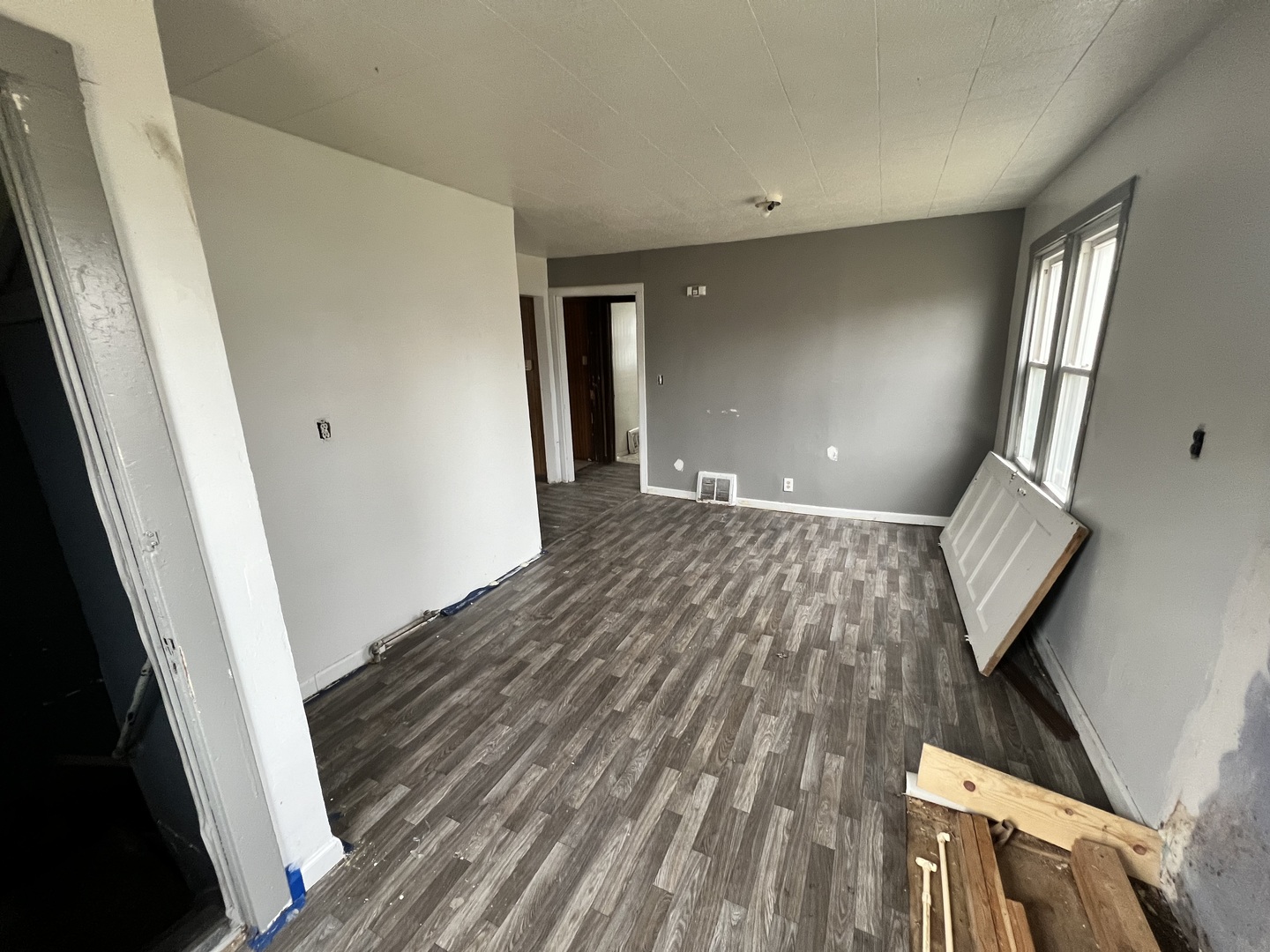 370 Albert Boulevard Kankakee, IL 60901 - Photo 6 of 20 a view of an empty room with wooden floor and stairs
