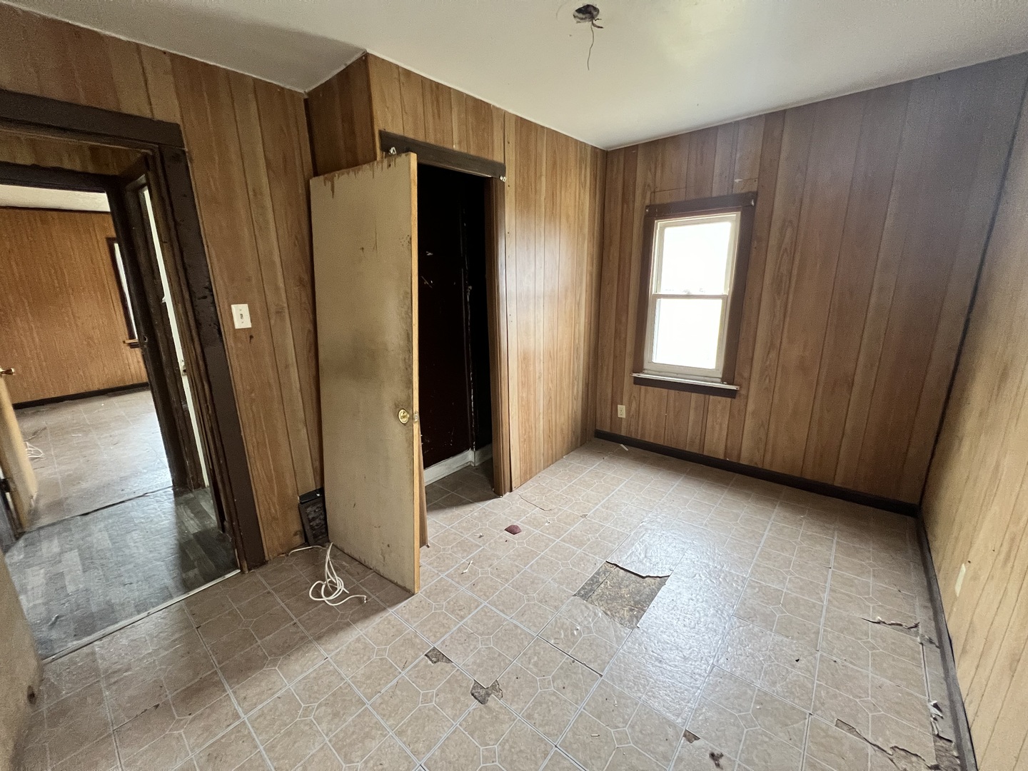 370 Albert Boulevard Kankakee, IL 60901 - Photo 7 of 20 a view of an empty room with a fireplace and a window