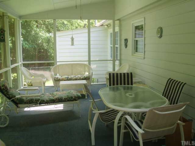 6428 Wynbrook Way Raleigh, NC 27612 - Photo 3 of 6 a dining room with furniture and wooden floor