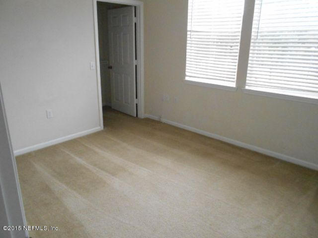 8550 Touchton Road, Unit 1327 Jacksonville, FL 32216 - Photo 11 of 14 an empty room with a window