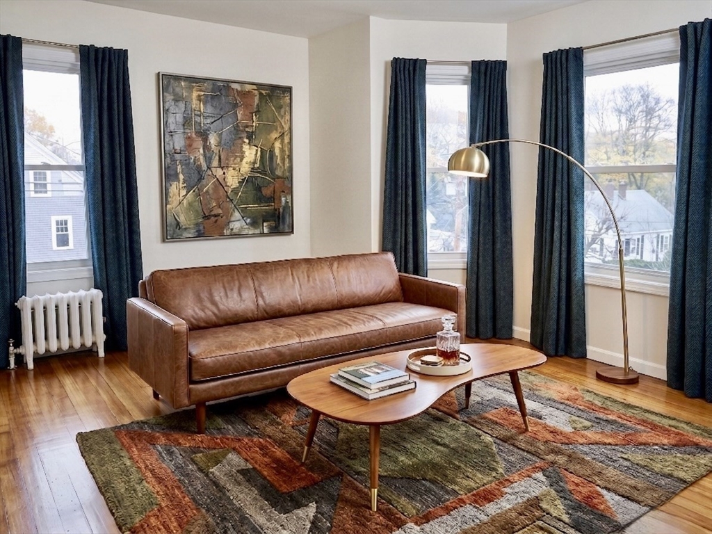 218 Whitman Avenue, Unit 2 Whitman, MA 02382 - Photo 2 of 15 a living room with furniture and a window