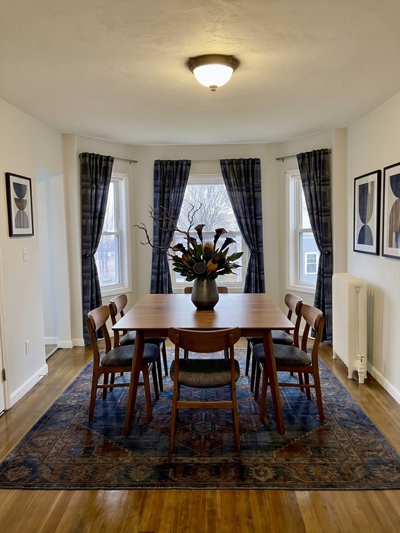 218 Whitman Avenue, Unit 2 Whitman, MA 02382 - Photo 3 of 15 a dining room with furniture and wooden floor