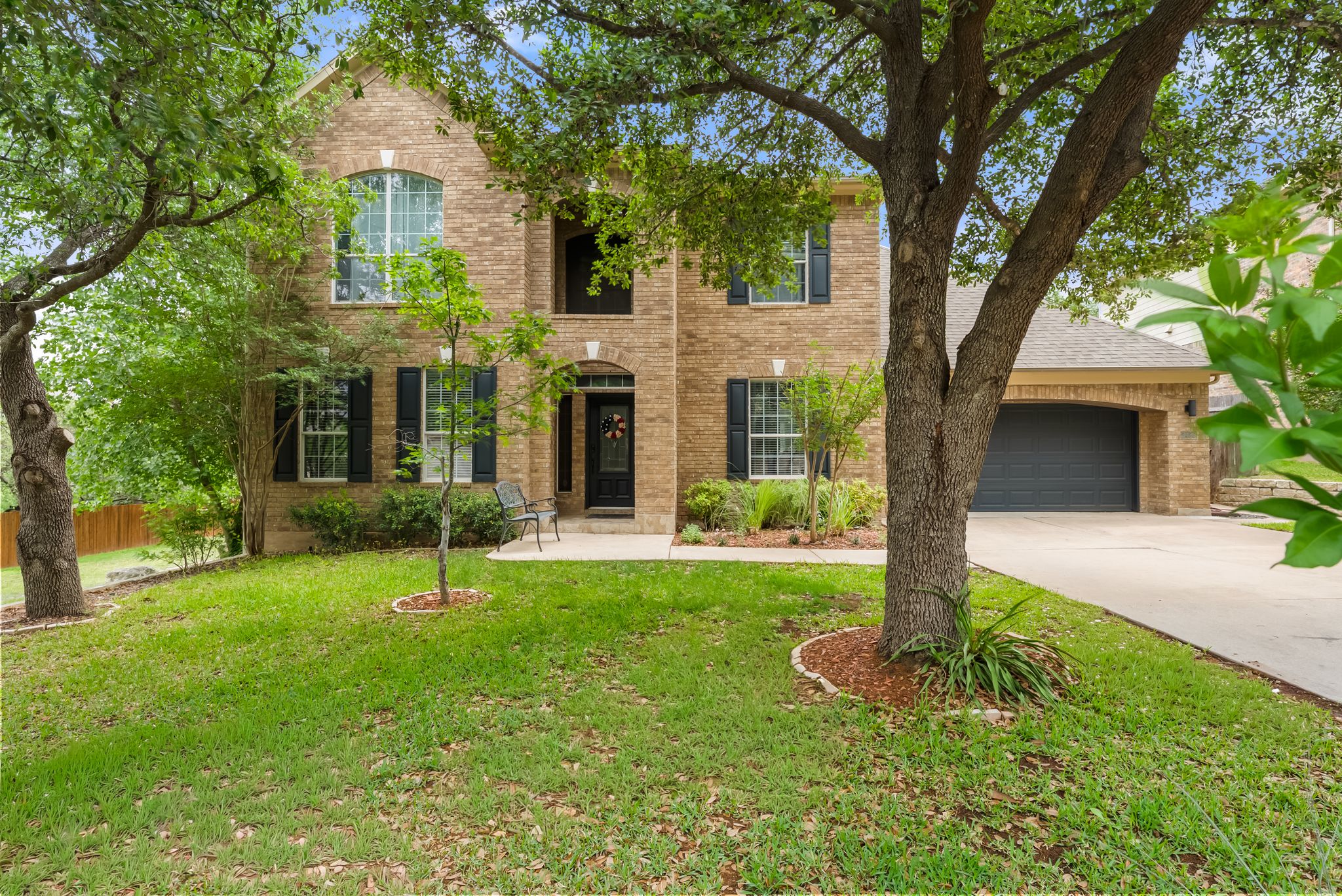 2429 Shire Ridge Drive Austin, TX 78732 - Photo 39 of 39 a front view of a house with a yard