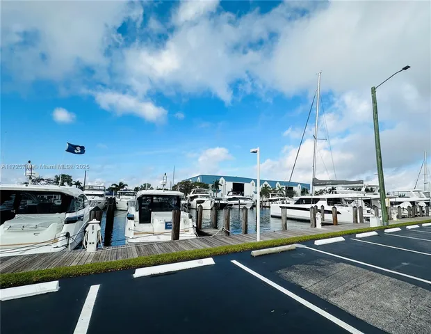 a view of sign board with flower around