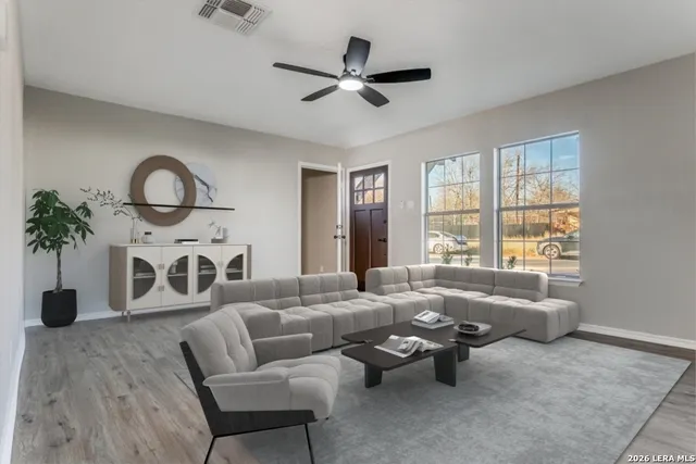 a living room with furniture and window