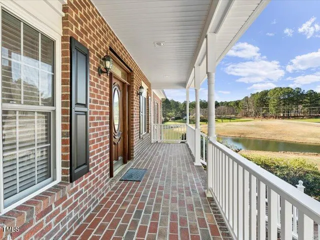 a view of balcony with wooden floor and outdoor space