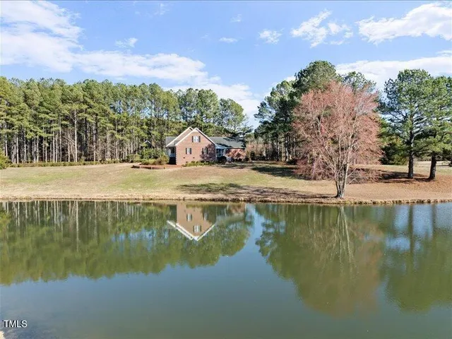 a view of lake with green space