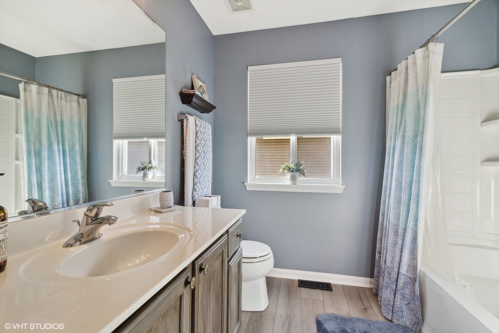 7802 Briarcliff Drive Plainfield, IL 60586 - Photo 14 of 26 a bathroom with a sink toilet and shower