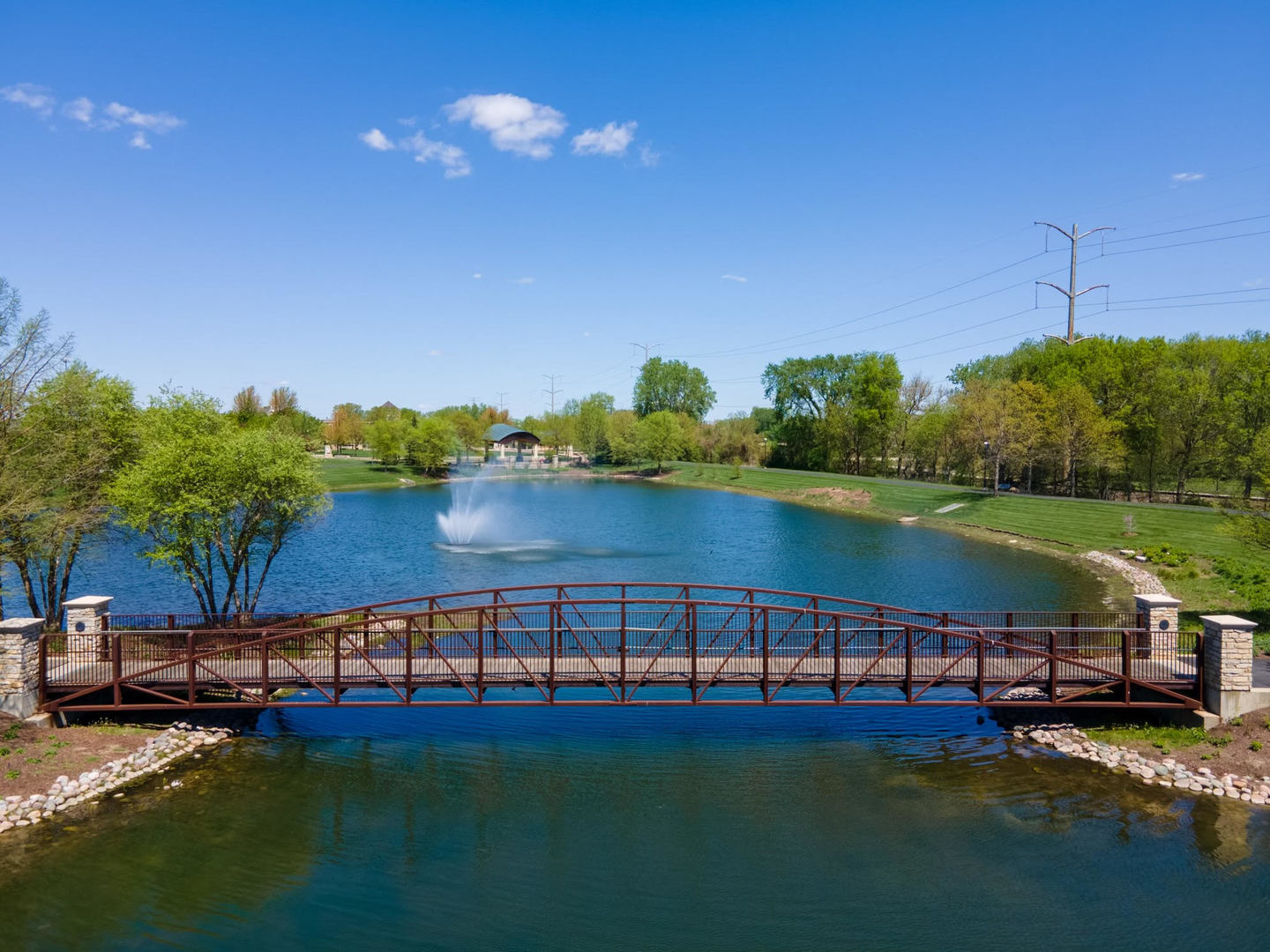 7802 Briarcliff Drive Plainfield, IL 60586 - Photo 25 of 26 a view of a lake with lawn chairs and a table