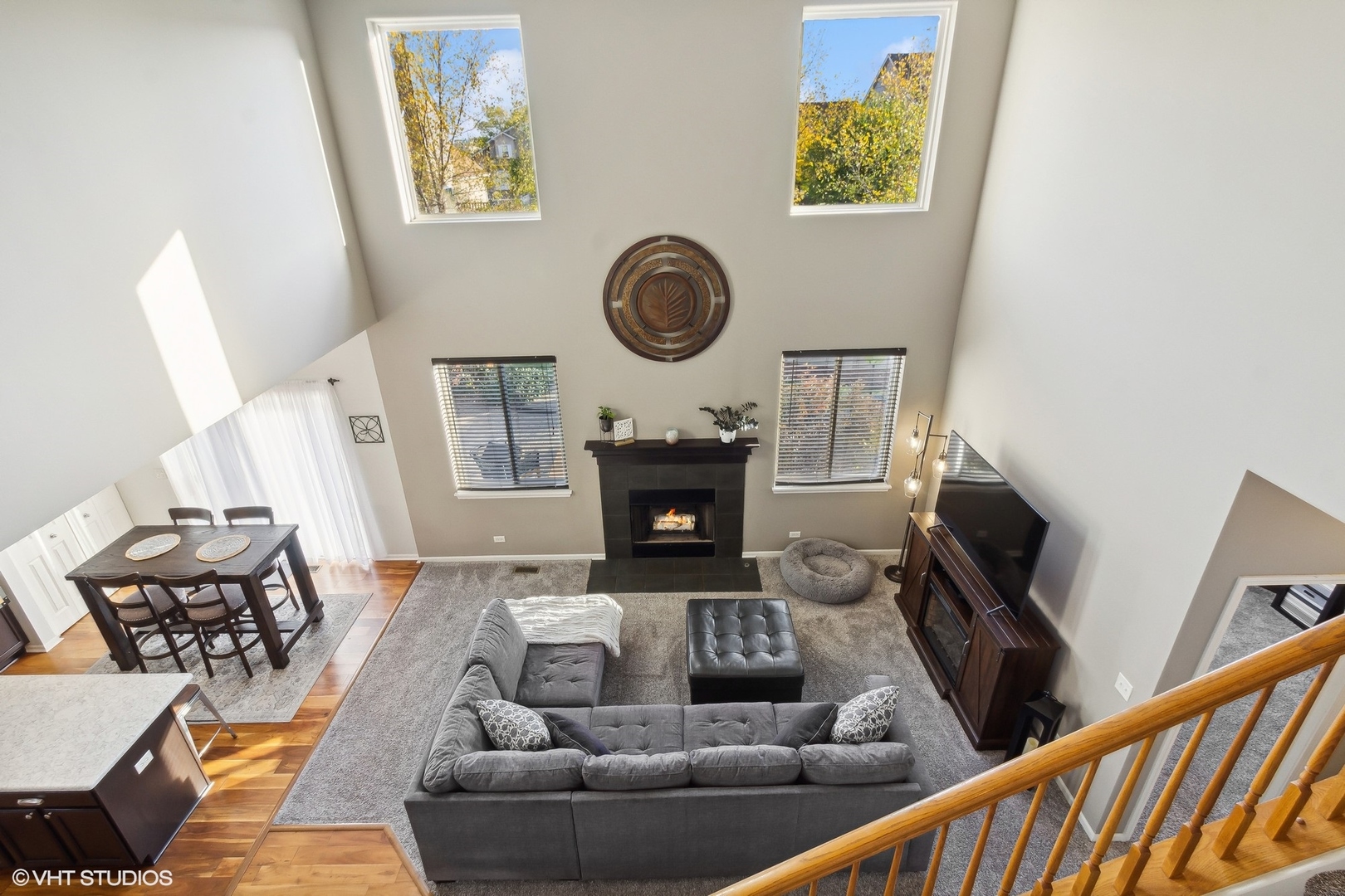 7802 Briarcliff Drive Plainfield, IL 60586 - Photo 3 of 26 a living room with furniture a flat screen tv and a fireplace