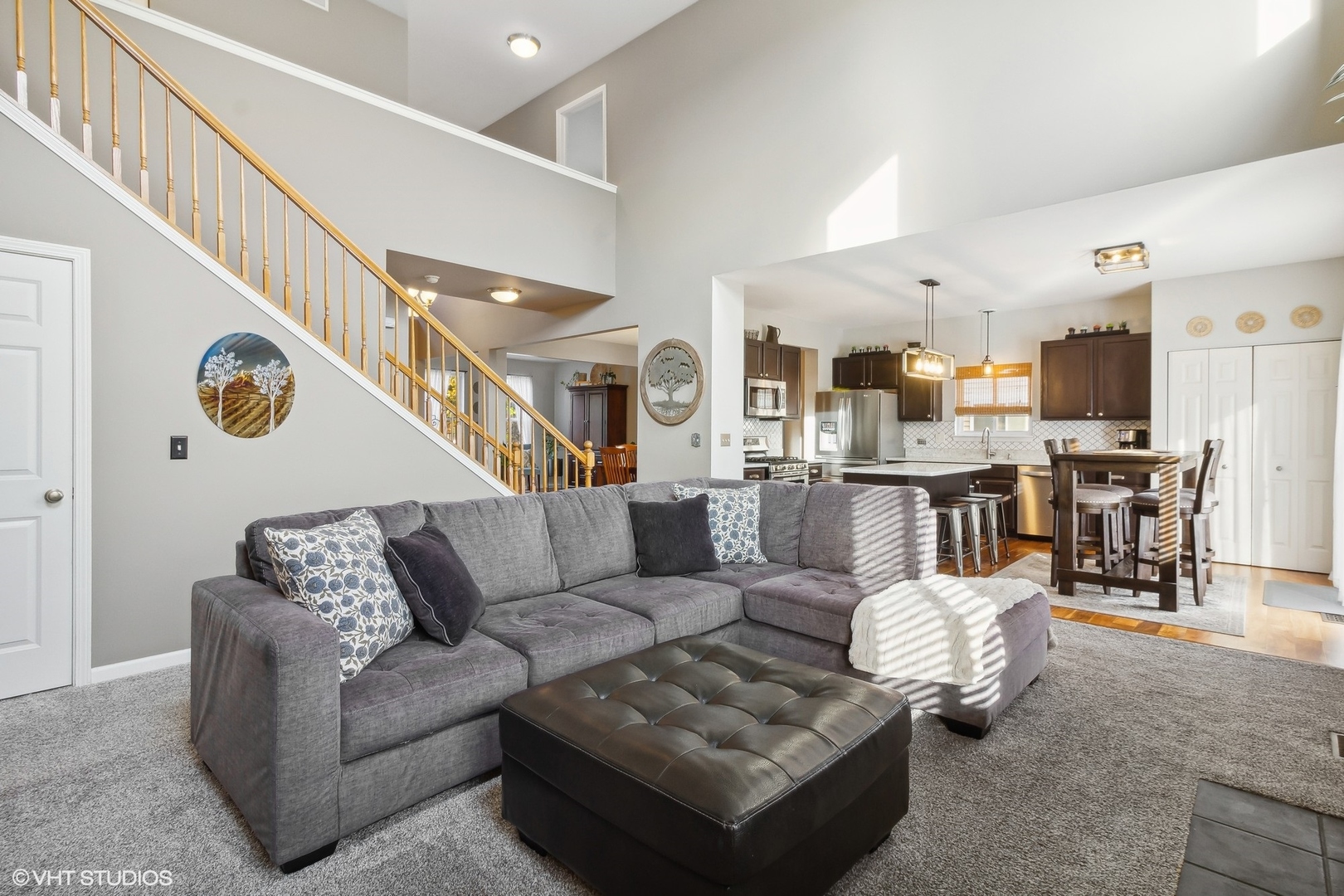 7802 Briarcliff Drive Plainfield, IL 60586 - Photo 4 of 26 a living room with furniture kitchen view and a chandelier