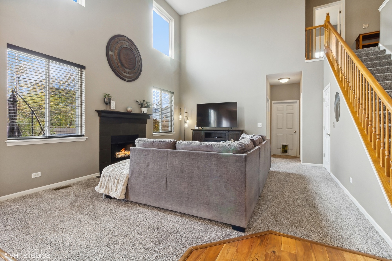 7802 Briarcliff Drive Plainfield, IL 60586 - Photo 5 of 26 a living room with furniture a fireplace and a window