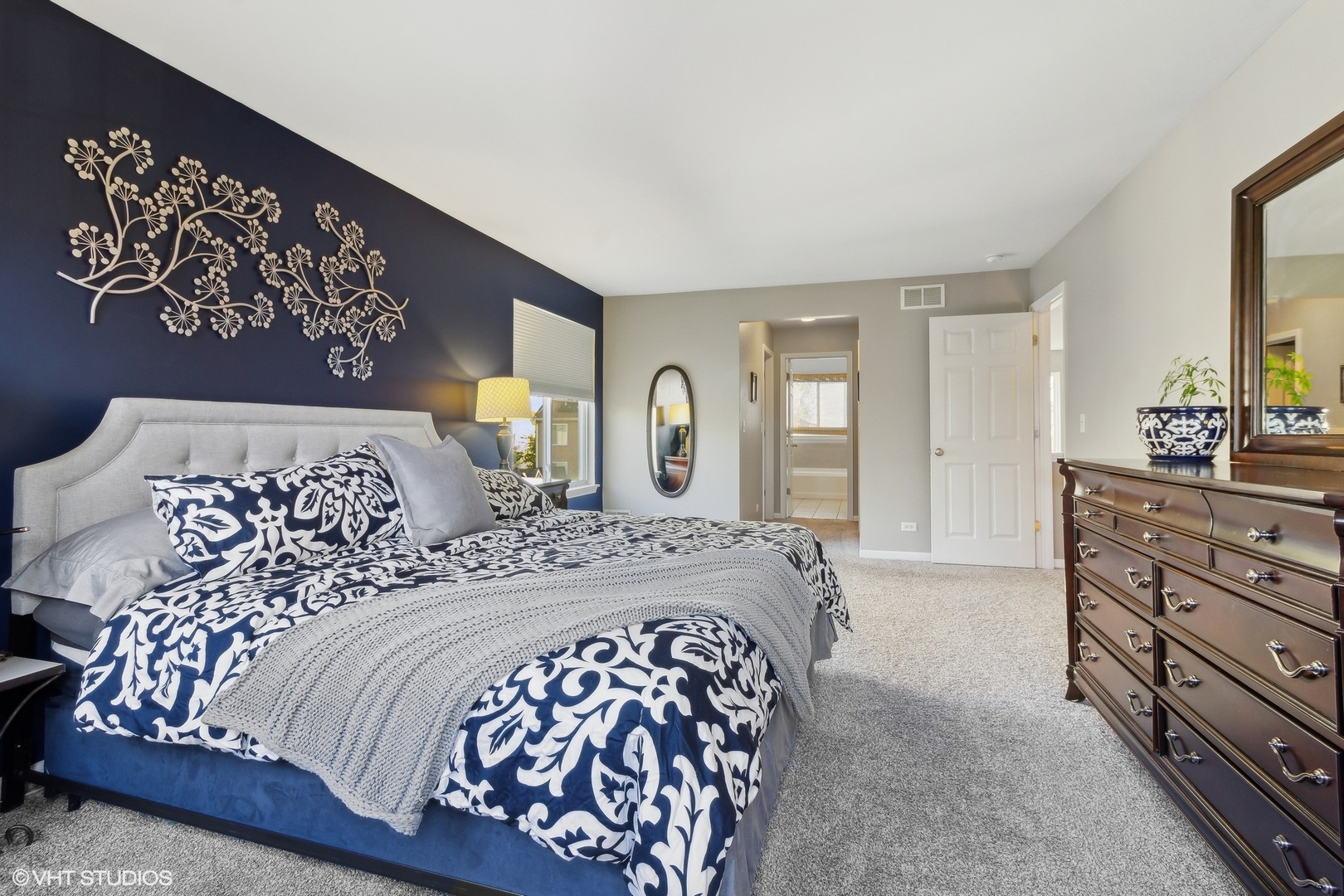 7802 Briarcliff Drive Plainfield, IL 60586 - Photo 7 of 26 a bedroom with a large bed and a dresser