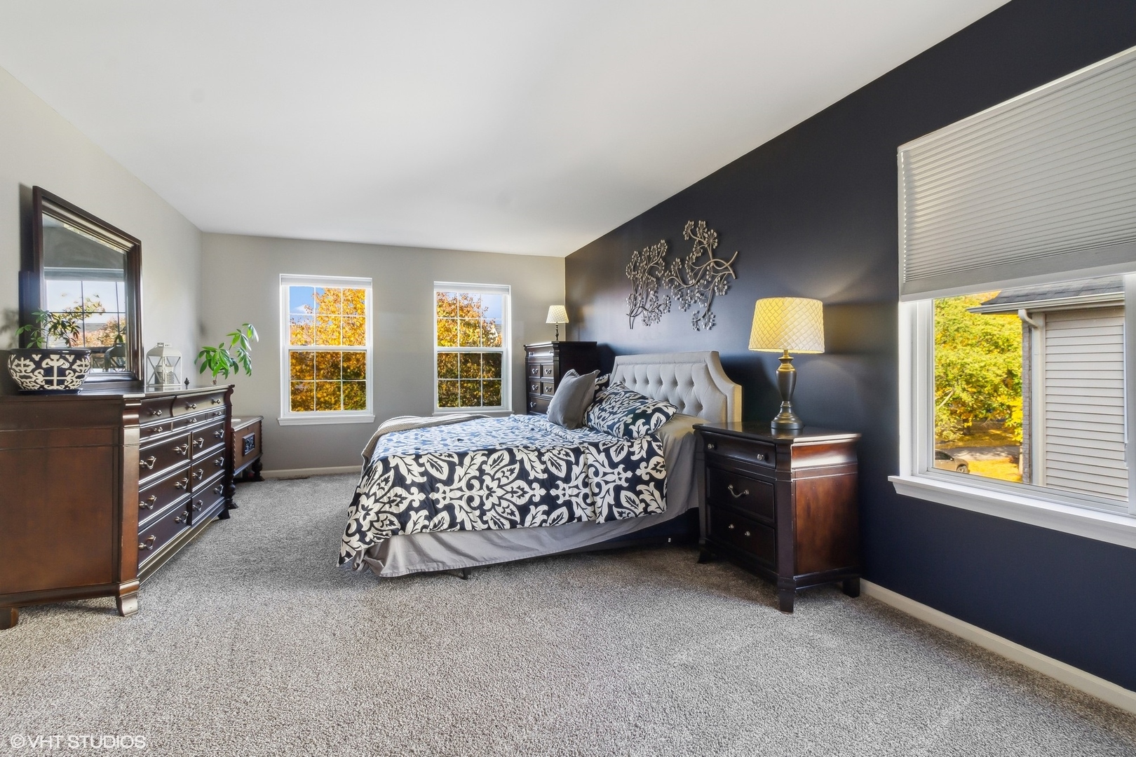 7802 Briarcliff Drive Plainfield, IL 60586 - Photo 8 of 26 a bedroom with a bed and a couch next to a window