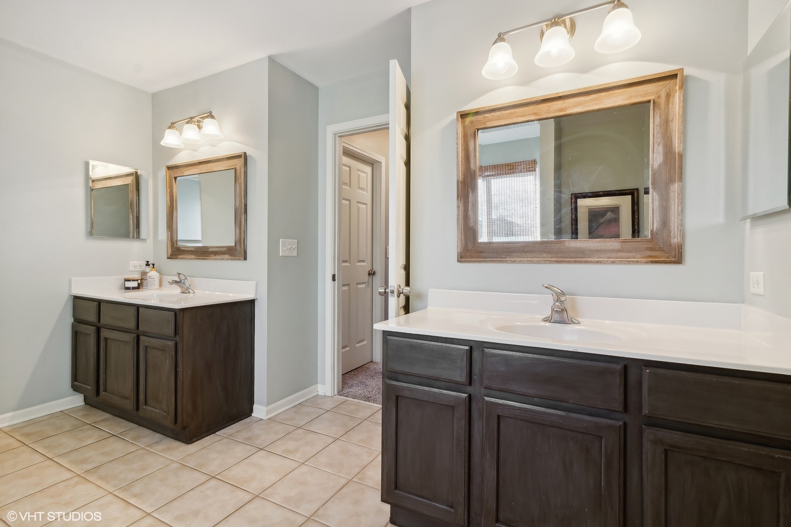 7802 Briarcliff Drive Plainfield, IL 60586 - Photo 10 of 26 a bathroom with a double vanity sink mirror and