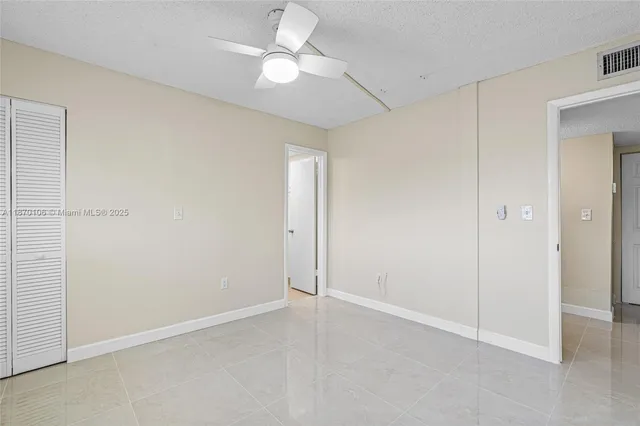 a view of a livingroom with a ceiling fan