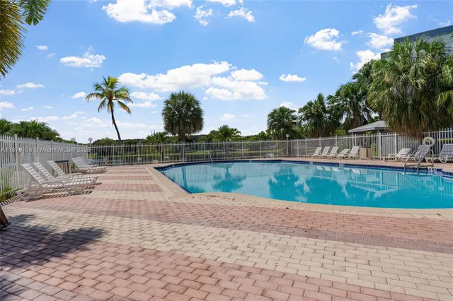 a view of a park with swings and slides