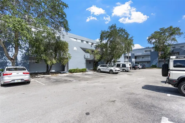a view of street with parked cars
