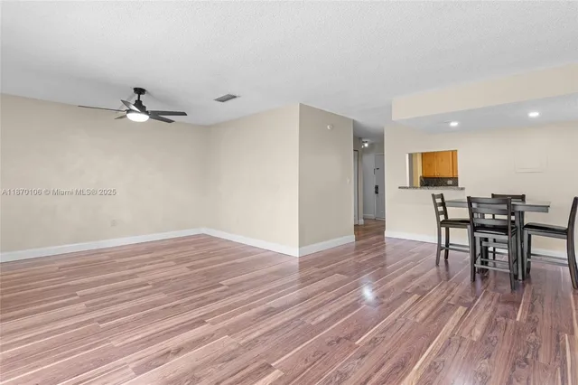 a view of a livingroom with furniture and wooden floor