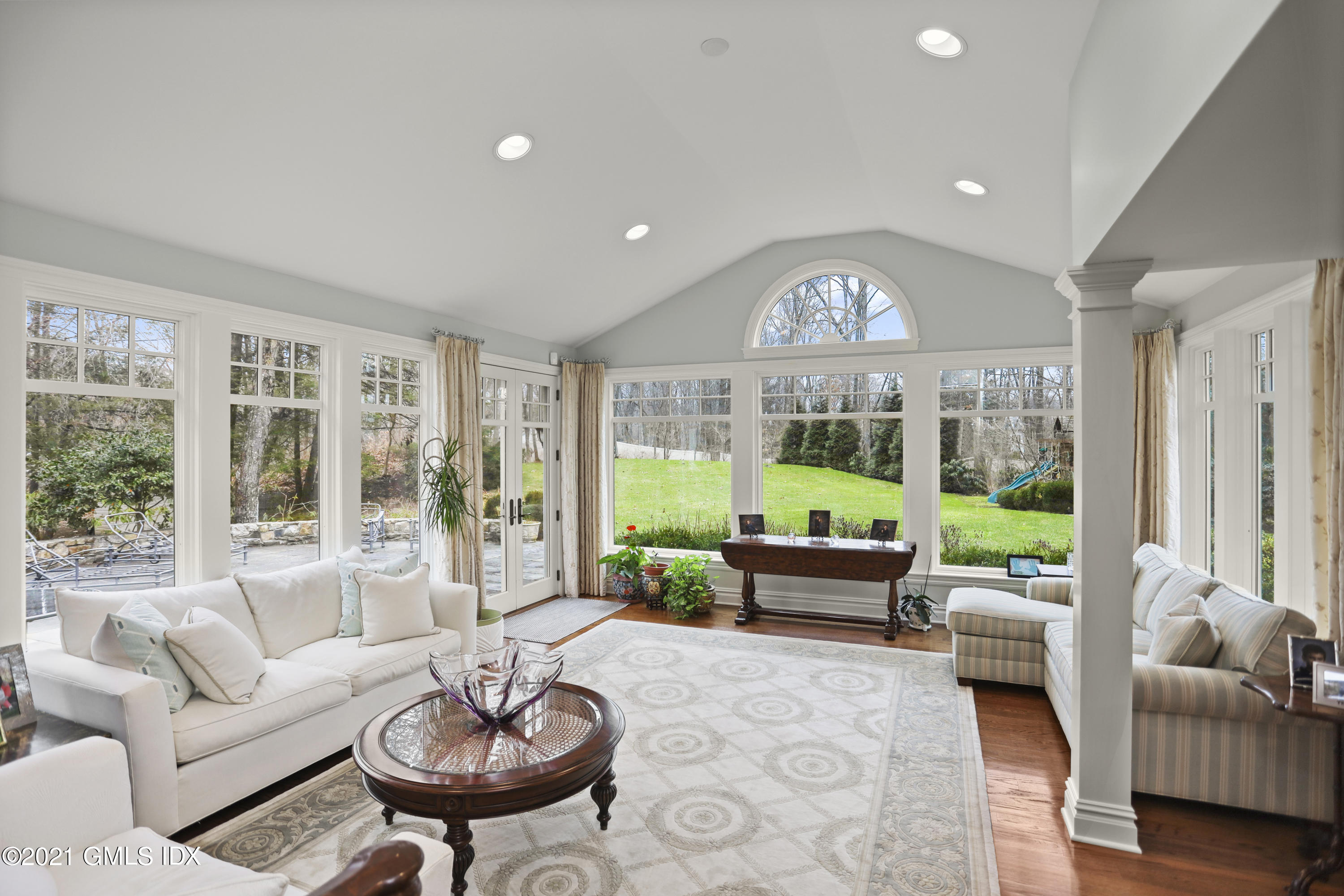 265 Riversville Road Greenwich, CT 06831 - Photo 15 of 47 a living room with furniture and a large window