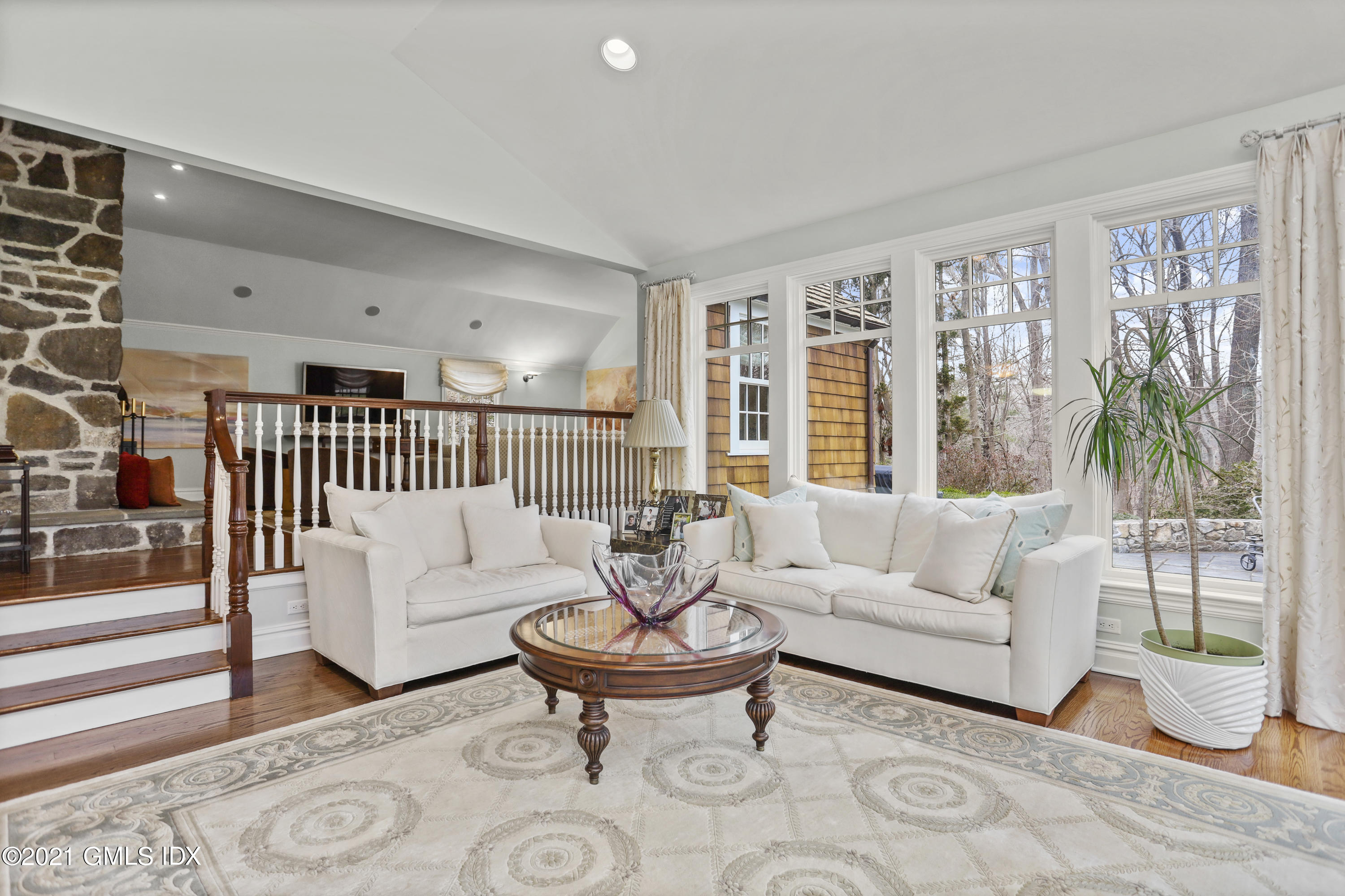 265 Riversville Road Greenwich, CT 06831 - Photo 16 of 47 a living room with furniture and a large window