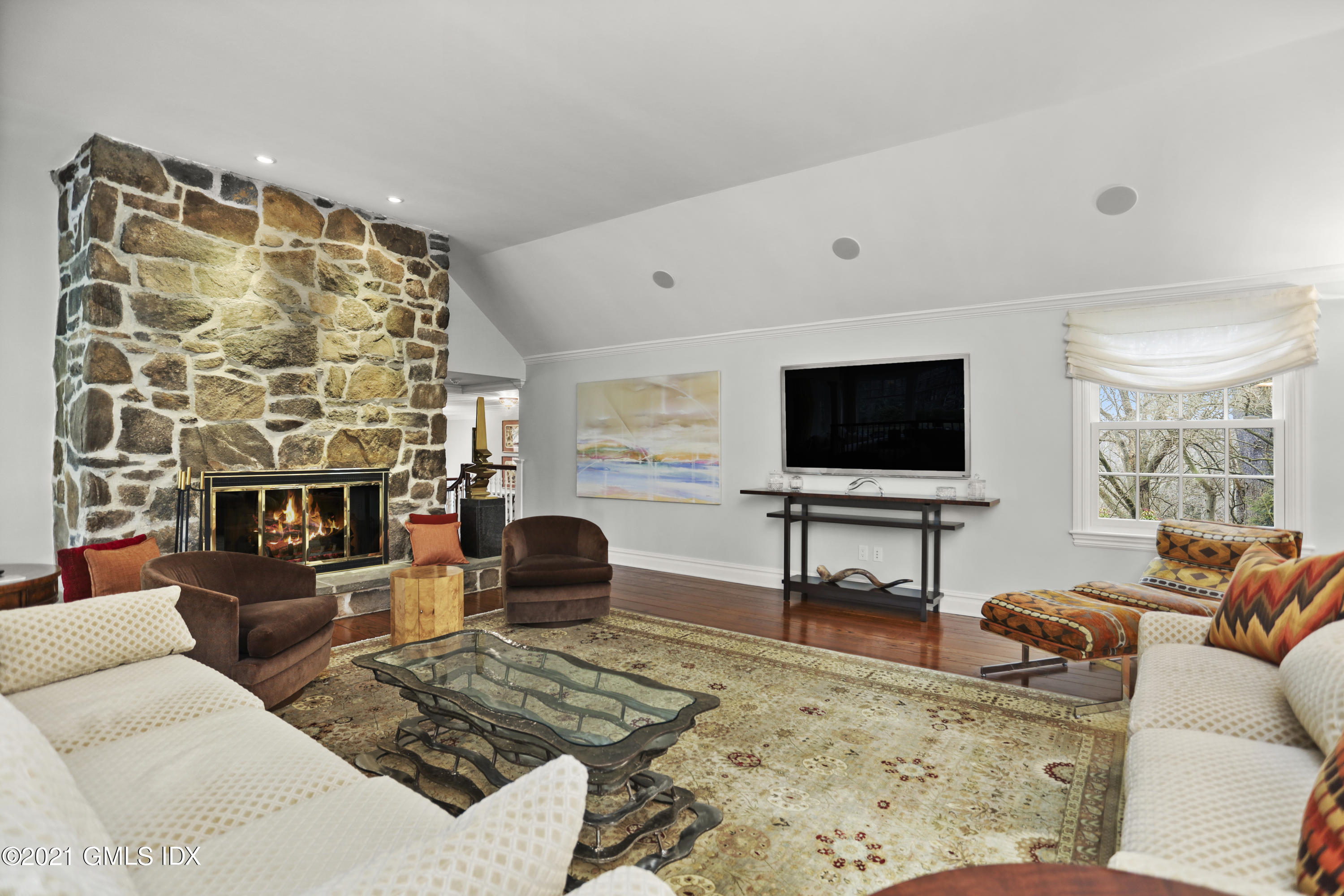 265 Riversville Road Greenwich, CT 06831 - Photo 19 of 47 a living room with furniture and a flat screen tv