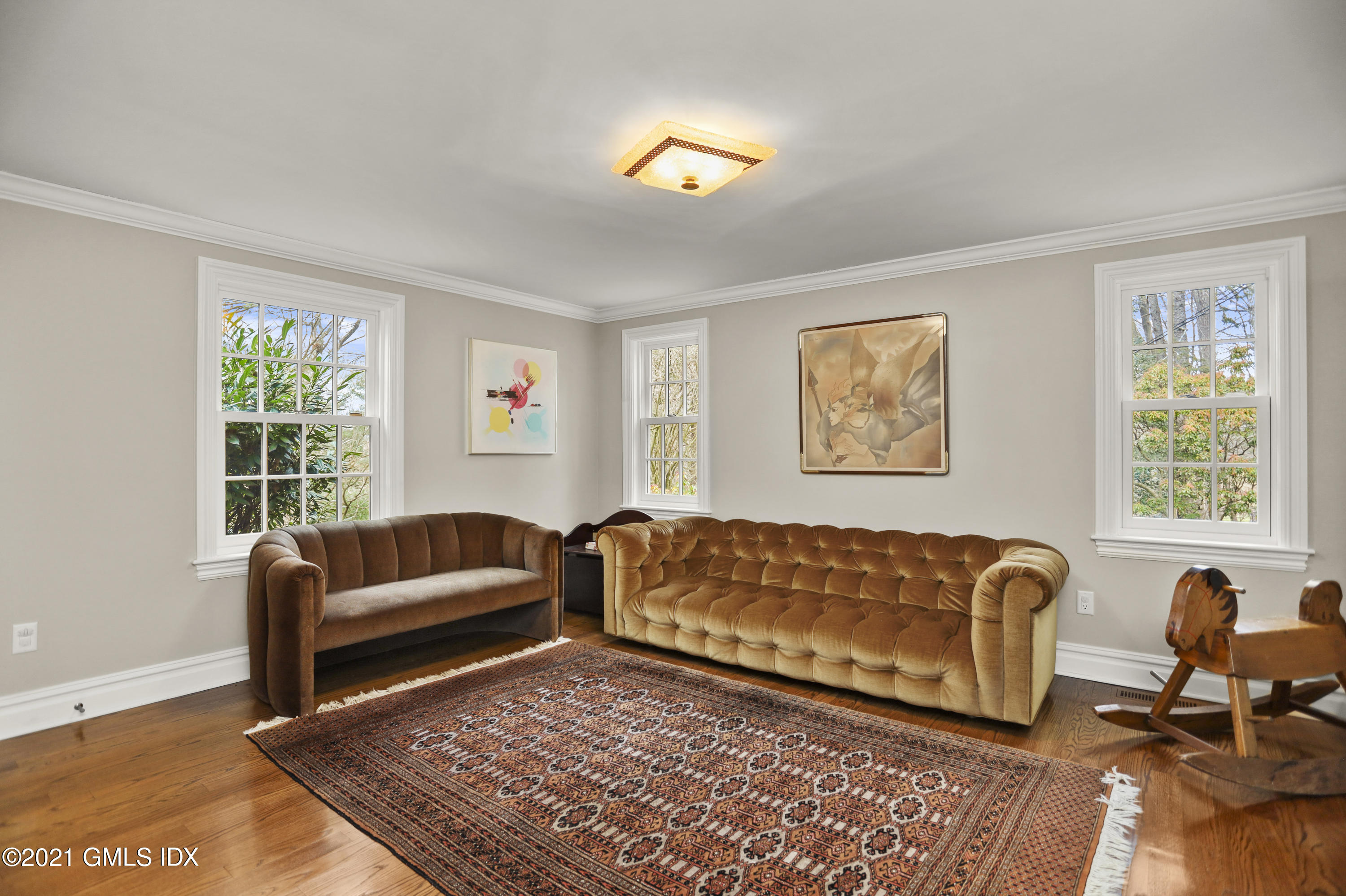 265 Riversville Road Greenwich, CT 06831 - Photo 20 of 47 a living room with furniture and a window