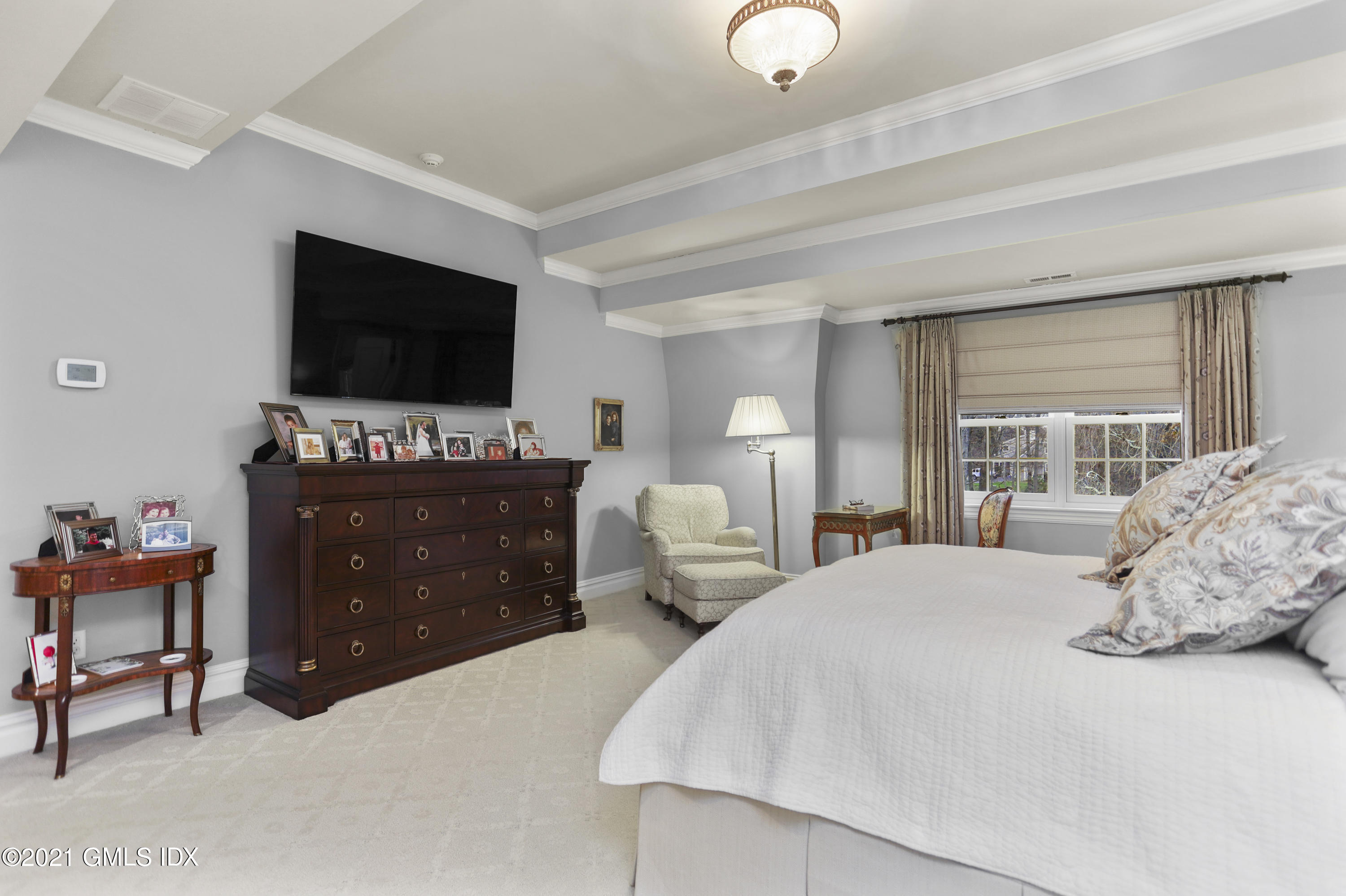 265 Riversville Road Greenwich, CT 06831 - Photo 24 of 47 a bedroom with bed and flat screen tv