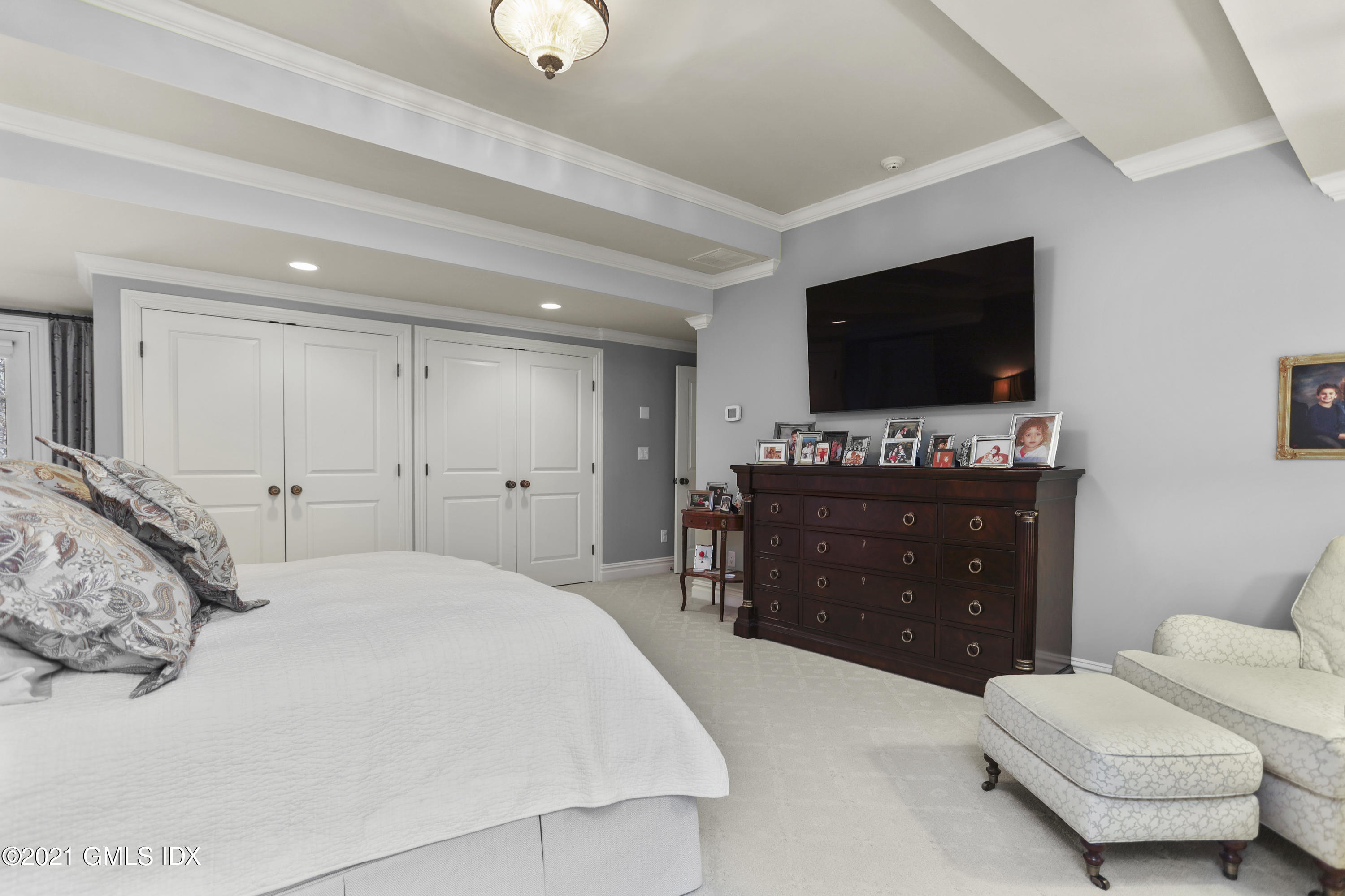 265 Riversville Road Greenwich, CT 06831 - Photo 25 of 47 a bedroom with a bed and a flat screen tv