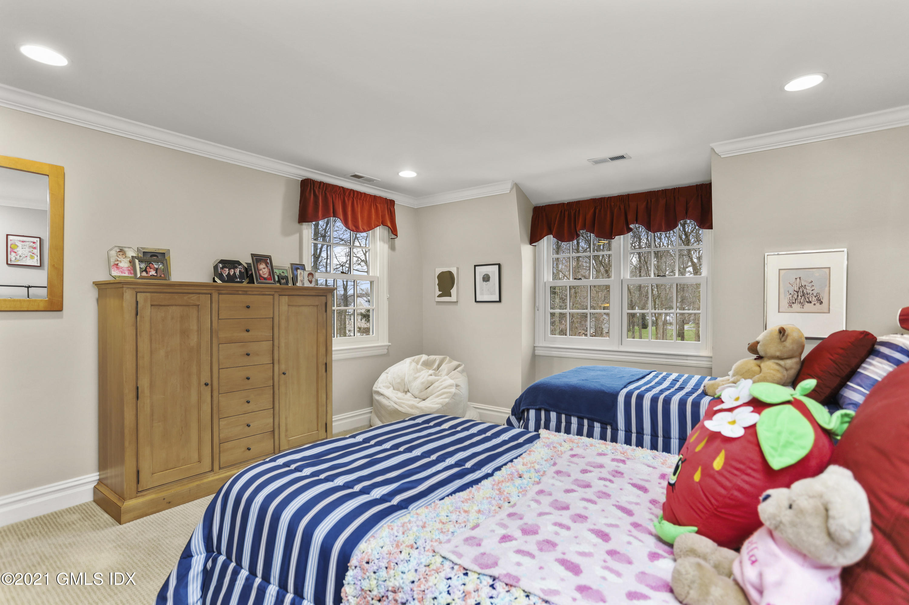 265 Riversville Road Greenwich, CT 06831 - Photo 32 of 47 a bedroom with a bed and wooden floor