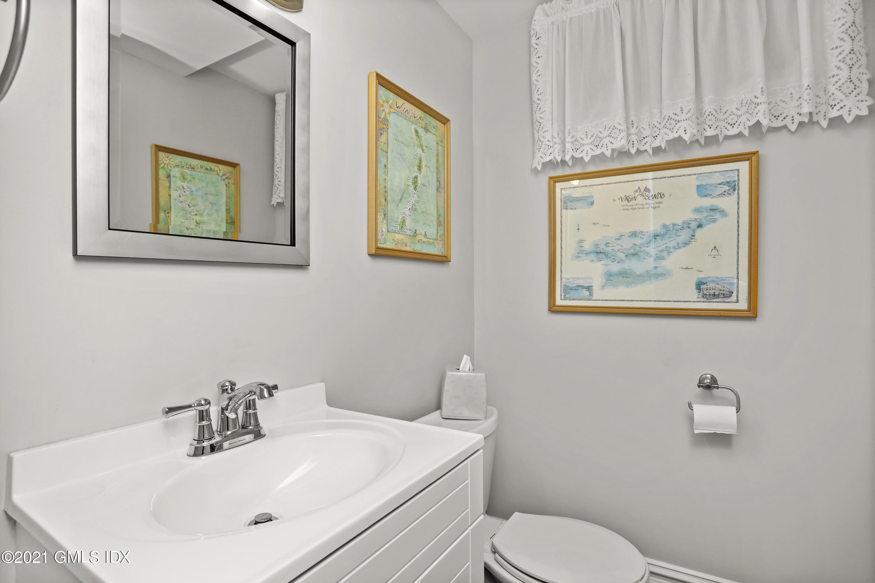 265 Riversville Road Greenwich, CT 06831 - Photo 38 of 47 a bathroom with a toilet a sink and mirror