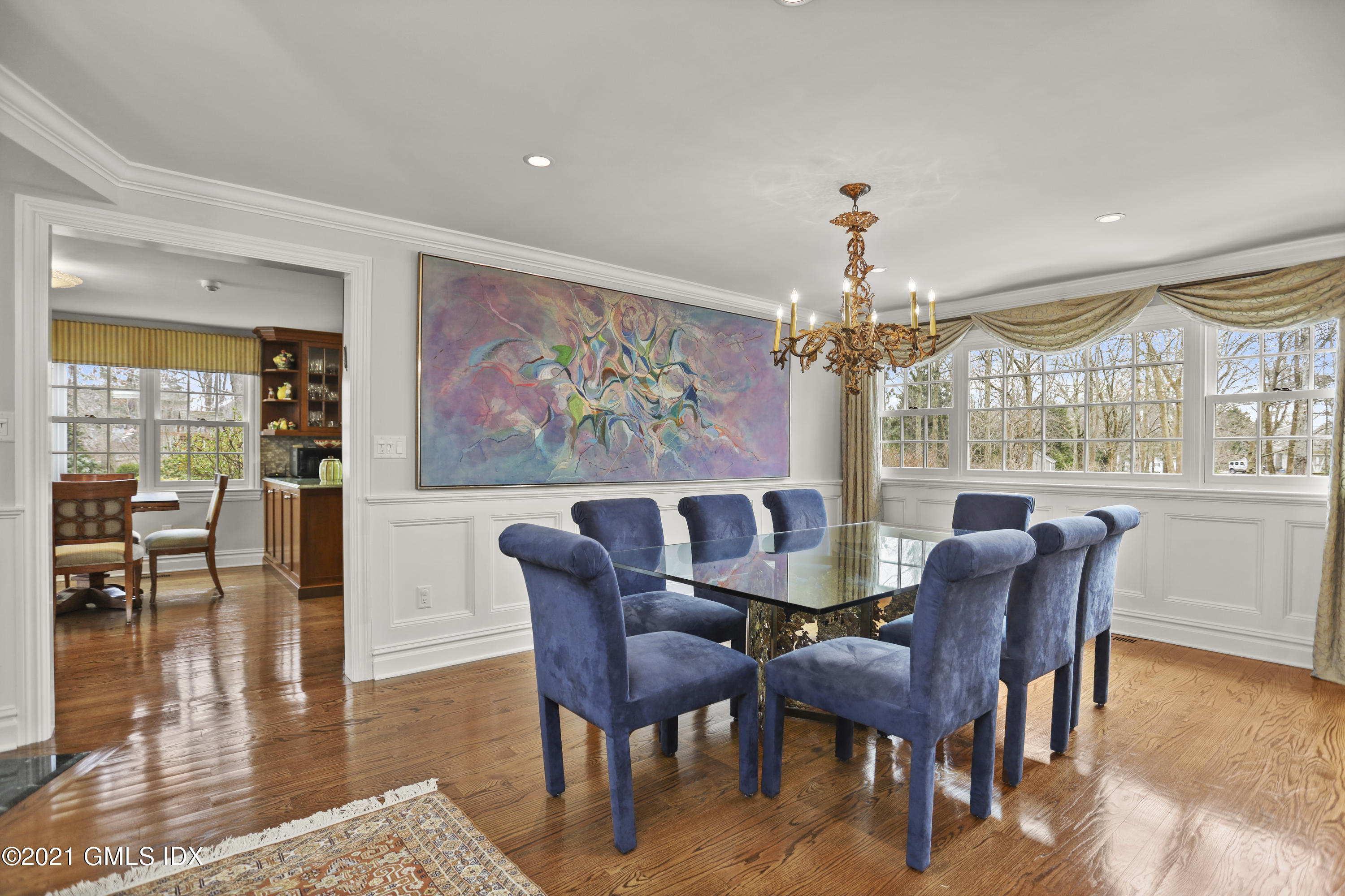 265 Riversville Road Greenwich, CT 06831 - Photo 8 of 47 a view of a dining room with furniture wooden floor and chandelier
