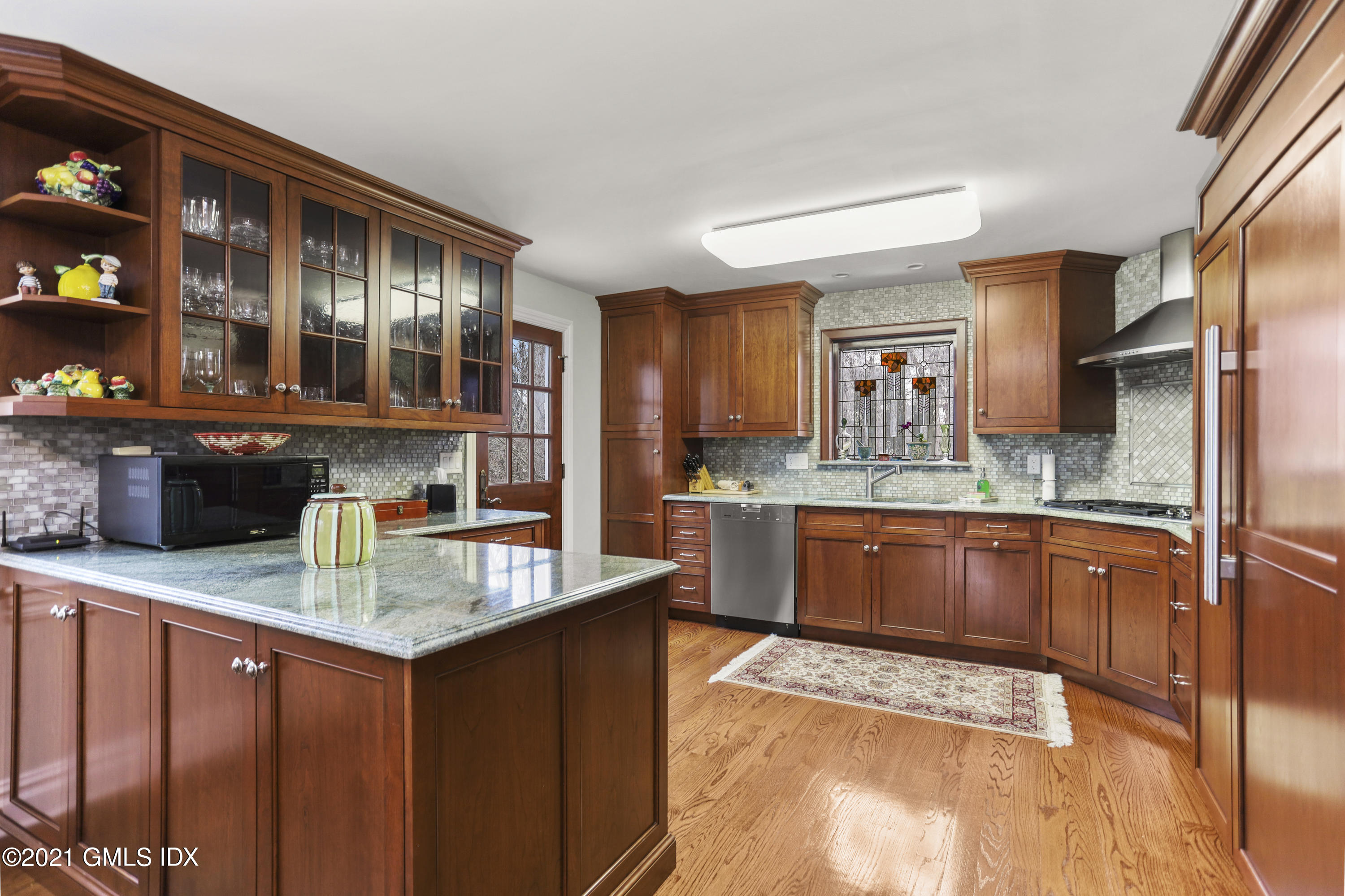 265 Riversville Road Greenwich, CT 06831 - Photo 10 of 47 a kitchen with stainless steel appliances granite countertop a sink stove and refrigerator