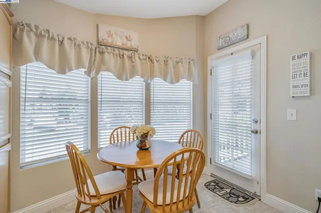 a view of a chair and table in the patio
