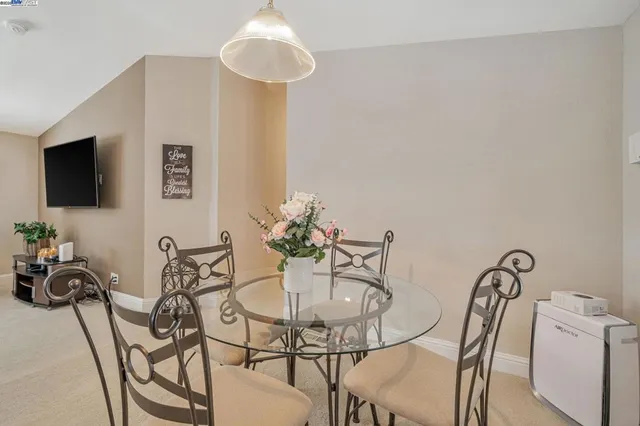 a view of a livingroom with furniture and a flat screen tv